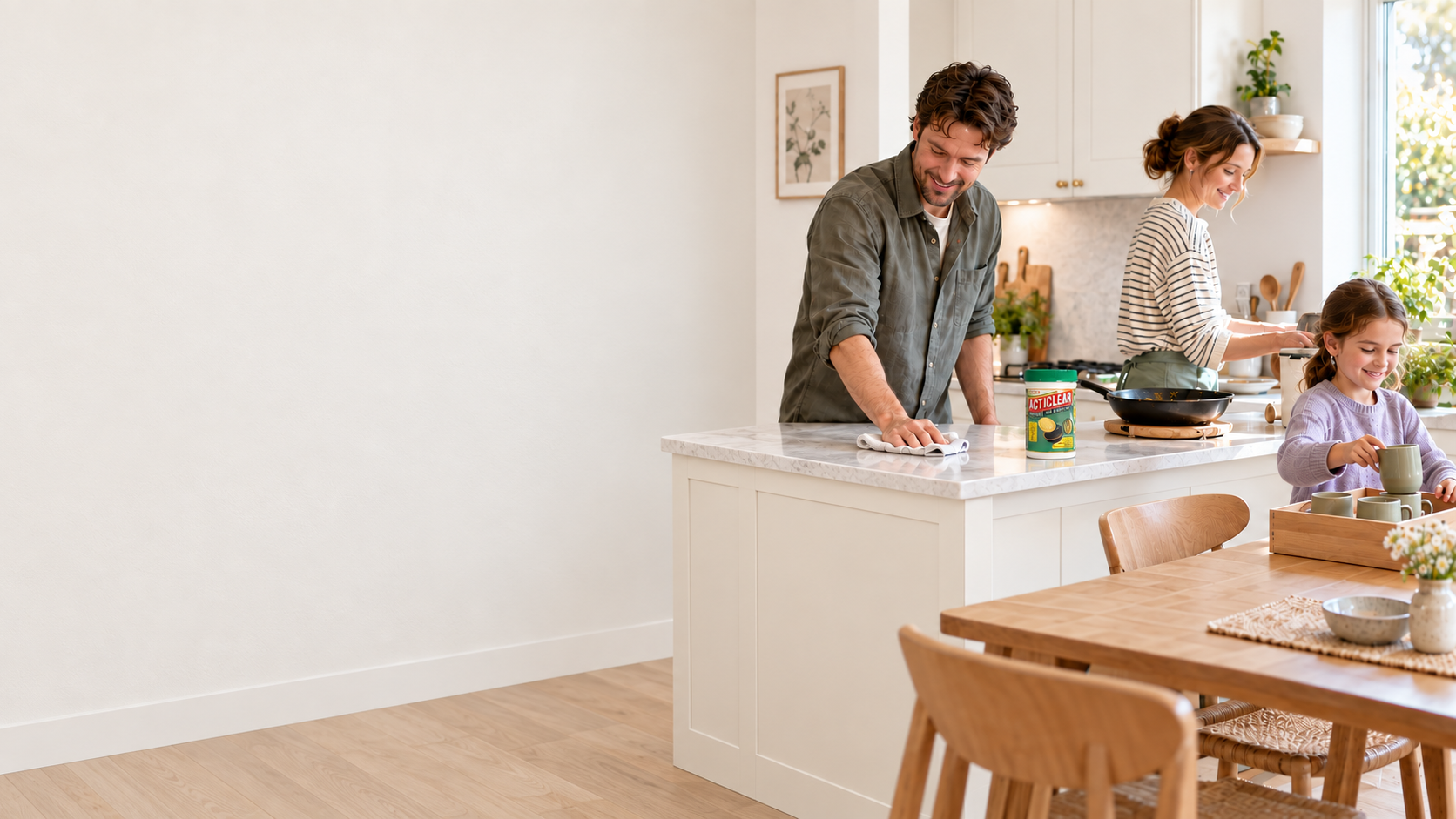 Illustrative family tidying a bright warm-white kitchen together, with ActiClear beside the used cookware